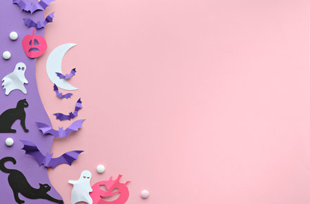 Cute Halloween background with kawaii black cats, vibrant purple paper bats, pink pumpkins, sugar sweets and funny white ghosts. Flat lay on pink and purple paper with white Moon.の写真素材