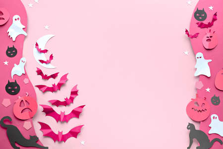 Cute Halloween background with kawaii black cats, vibrant purple paper bats, pink pumpkins, sugar sweets and funny white ghosts. Flat lay on pink and purple paper with white Moon.の写真素材