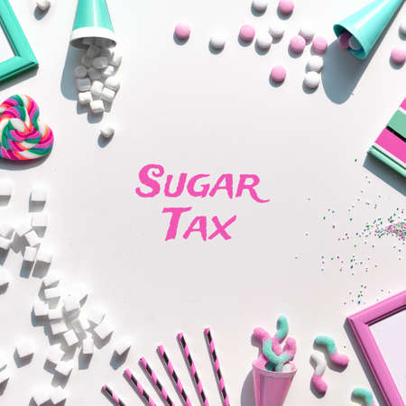 Text Sugar Tax. Various tasty snacks in pastel colors, pink, mint green, on white background. Excess of sweets, chocolate, candy, sweet food. Concept background in white, pink and mint green.の写真素材