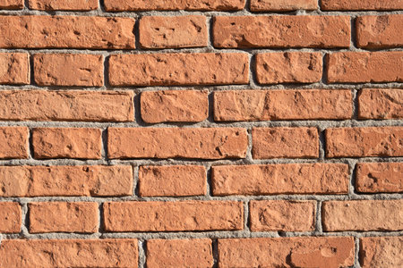 Vintage, old orange brick wall texture. Top view, flat lay natural red background.の写真素材