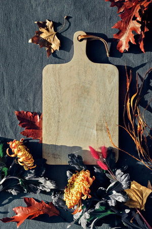 Frame made with Autumn decorations. Paper mockup with shadows. Autumn decorations - cranberry,...