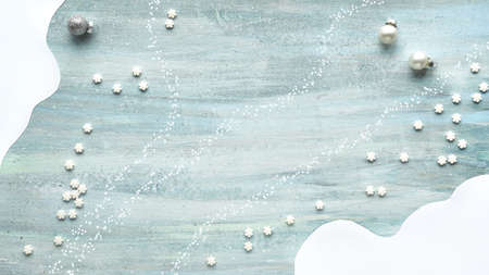 Minimal Christmas panoramic background. Silver baubles and sugar stars on light blue textured wood, abstract organic shapes. Space for text, copy-space. Backdrop for stories about winter holidays.の写真素材