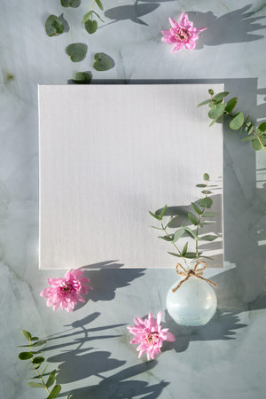 Springtime mockup with blank square canvas and Spring decorations. Pink chrysantemum flowers,...