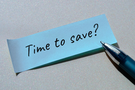 Question time to save written on sticky paper, office sticker with pen. Simple minimal handwritten note on neutral grey background.の写真素材