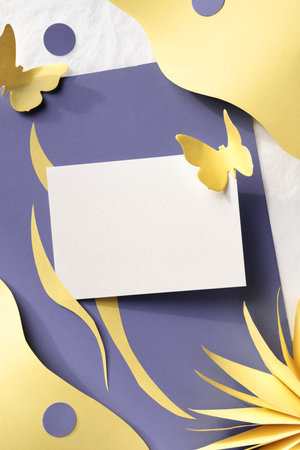 Layered purple yellow paper background with flowers and butterflies. Flat lay, top view with copy-space on paper card. Floral Springtime background, pastel colors, paper art style.の写真素材