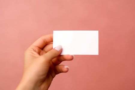 A person holding a business card in their hand. Generative AI image.の素材