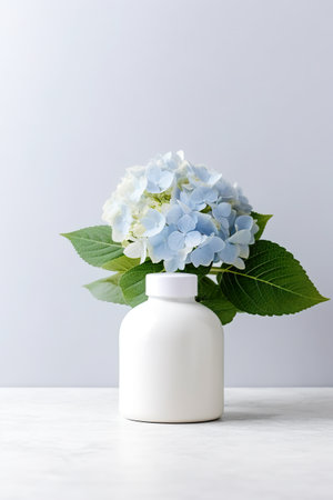 A white vase filled with blue and white flowers. Generative AI image. Blank beauty product mockup.の素材