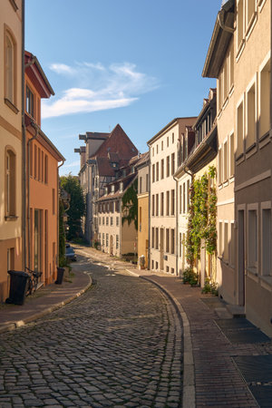 An old cobblestoned lane, Amberg lane in the old town of Rostockの写真素材