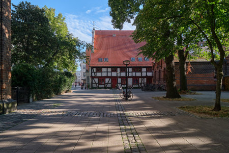 Pedastrian zone leading to a timbered historical house next to Church of Mary in Rostockの写真素材