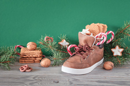 St Nicholas Day or Nikolaus. Children shoes filled with traditional sweetsの写真素材