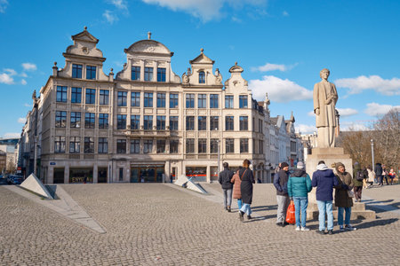 A group of people standing in front of a buildingのeditorial素材