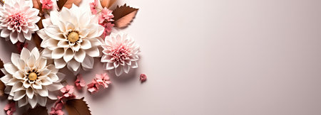 A bunch of paper flowers on a white surface. Pink and cream color floral banner with copy-space, place for text.の素材