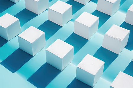 A group of white cubes sitting on top of a blue surfaceの素材