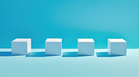 A row of white cubes sitting on top of a blue surfaceの素材
