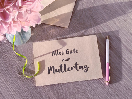 Piece of Paper With Attached Note Alles Gute zum Muttertag, or All the Best on Mothers Day in German.の写真素材