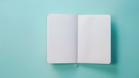 Mockup, Open Notebook on Blue Mint Backgroundの素材