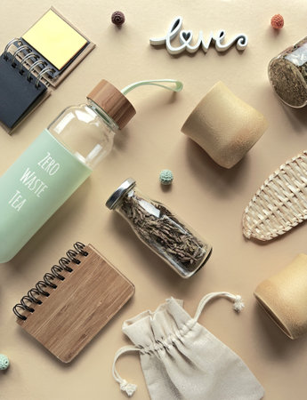 Zero waste tea background, low impact alternatives to plastic objects in making tea on yellow paperの写真素材