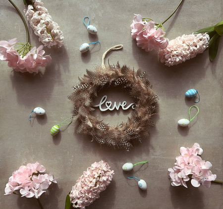 Feather Wreath Surrounded by Flowers and Butterfliesの写真素材