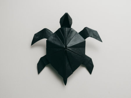 Black Origami Turtle on White Background, Symbolizing Creativity and Patienceの素材