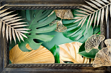 Exotic Tropical Frame with Gold and Green Leaves for Decorative Design, Posters, and Art Printsの写真素材