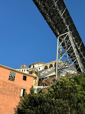 Underneath a Majestic Steel Bridge with Historic Architecture, Porto Dom Luis I Bridge Over Douro...