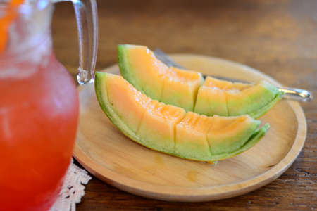 cantaloupe in a dishの写真素材