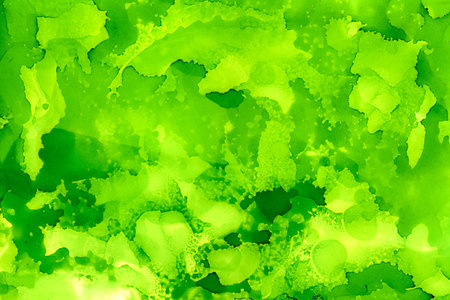Light grass green uneven with texture.Colorful background hand drawn with bright inks and watercolor paints. Color splashes and splatters create uneven artistic modern design.の写真素材