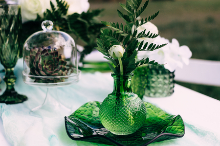 wedding flower decoration in the park, flower-decorated table, natural flowers, peony, rosesの写真素材