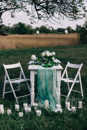 Table setup for wedding romantic ceremony dinner outdoors.の写真素材