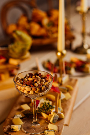 Assortment of nuts in bowls. Cashews, hazelnuts, walnuts, pistachios, pecans, pine nuts, peanuts, macadamia, almonds, brazil nuts. Food mix on wooden background top view copy spaceの写真素材