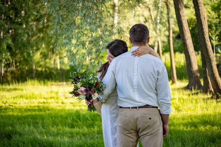 nice portrait of beautiful and young groom and bride outdoorsの写真素材
