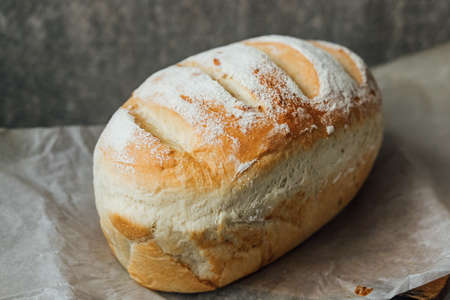 Homemade, fresh bread cools down after baking. selective focus. place for text.の写真素材