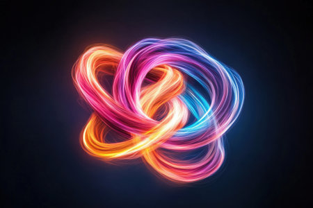 Vivid neon light swirl on dark background creating abstract pattern.の写真素材