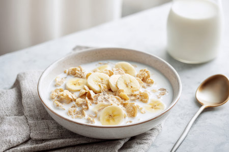 Delicious bowl of banana cereal with milk for a healthy breakfast.