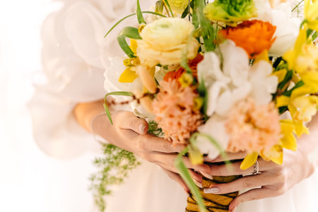 Close-up of bridal bouquet with diverse flowers on wedding day.の写真素材