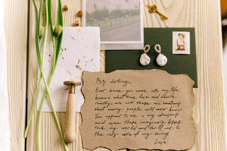 Vintage love letter and botanical flat lay with earrings.の写真素材