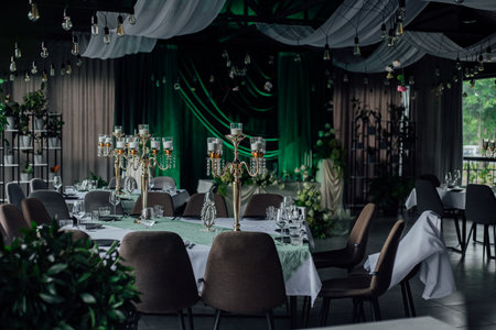 Elegant event venue with luxurious decor and green accents.の写真素材