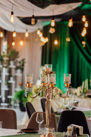 Elegant indoor event venue with candles and ambient lighting decor.の写真素材