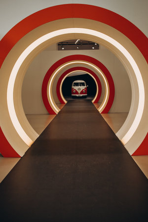 Retro van inside a futuristic tunnel with illuminated circular designの写真素材