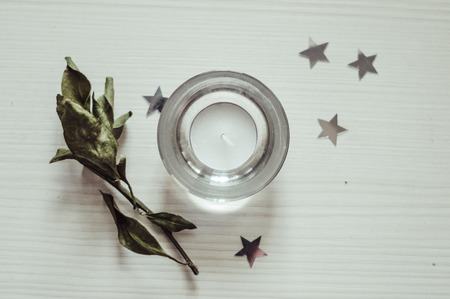 candle standing on a white wooden background topの写真素材