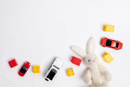 toys constuctor and cars, top view on white background, place for textの写真素材