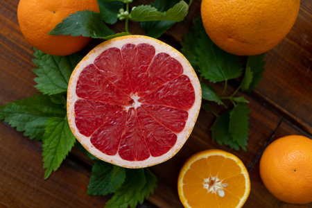 oranges on a brown wooden background, text space, citrus