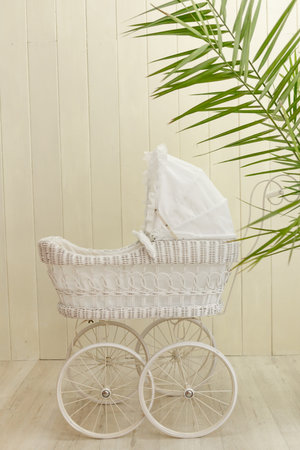 a beautiful white vintage stroller for baby