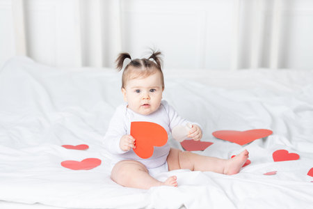 baby with red hearts, valentine's day concept