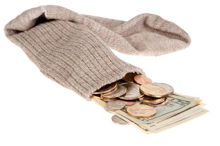 Dollar banknotes and coins in an old grey sockの写真素材
