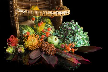 Basket with autumn flowers, berries and gourdsの写真素材