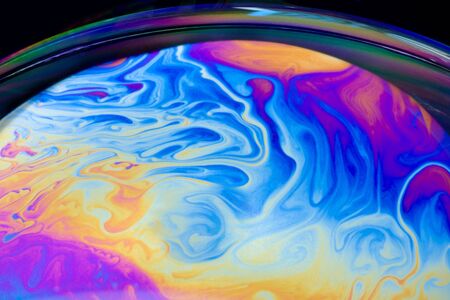 Closeup of a soap bubble looking like a space planetの写真素材