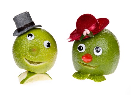 Funny fruit with face, googly eyes and hatの写真素材