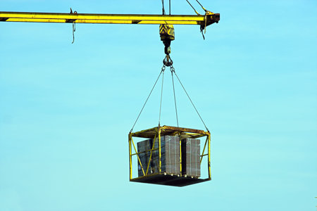 Detail of crane loading a ship at Antwerp harbourの写真素材