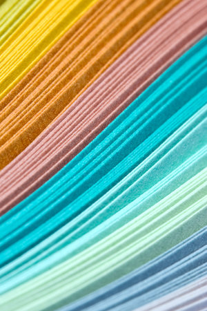 Abstract design of paper filigree strips in pastel colors